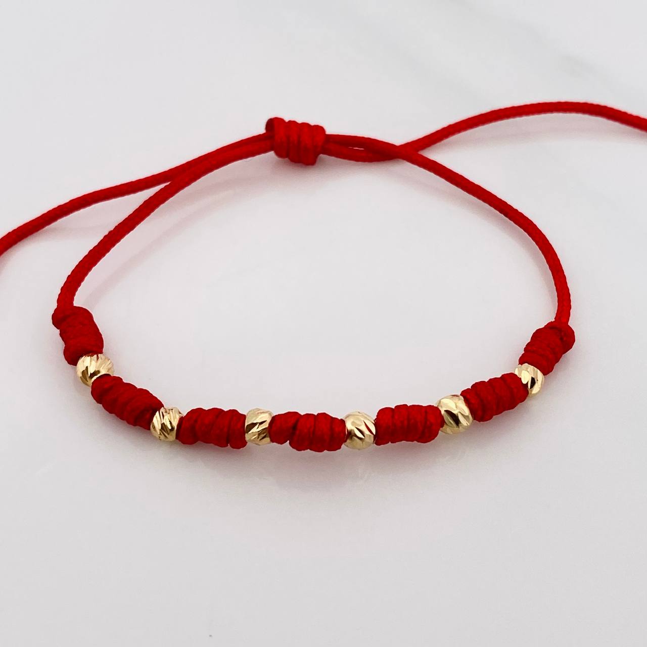 Pulsera Tejida Roja Siete Nudos Oro Amarillo 18K