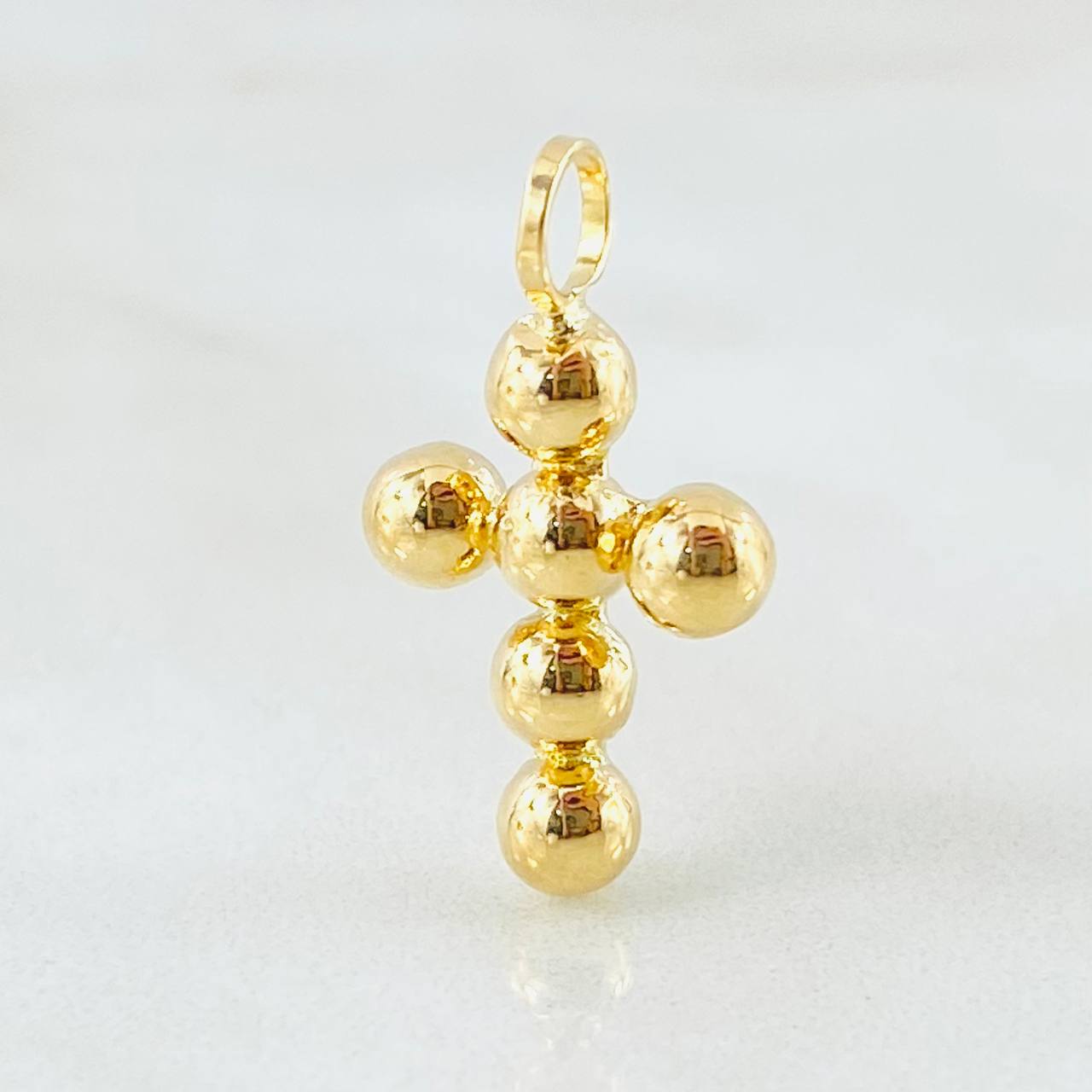 Dije Cruz Esferas Consecutivas 0.7gr / 2cm / Oro Amarillo 18K ©