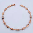 Pulso Corona RX 4.25gr / 21.8cm / 4mm Cauchos Negros Oro Rosa 18K $
