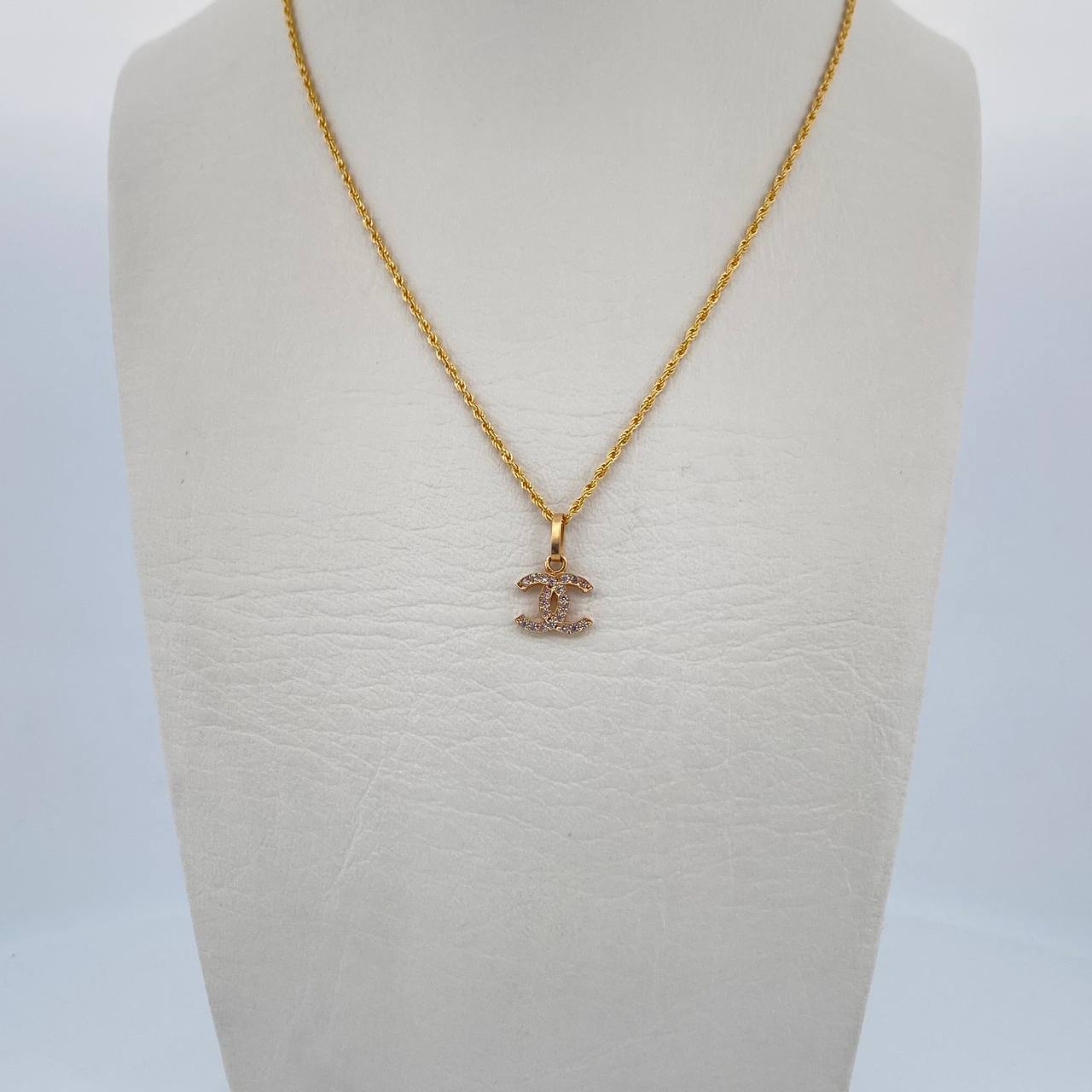 Set Cadena Lazo 1gr / 50cm / 1.1mm + Dije Ola Cruzada 0.5gr / 1.3cm Circones Blancos Oro Amarillo 18K (Oferta) $