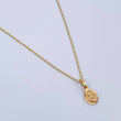 Set Cadena Singapur 1.05gr / 45cm / 0.7mm + Dije Divino Niño 0.65gr / 1.4cm Diamantado Oro Amarillo 18K (Oferta) $