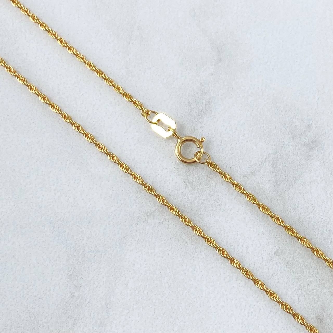 Set Cadena Lazo 1gr / 50cm / 1.2mm + Dije Ancla 0.45gr / 1.7cm Oro Amarillo 18K