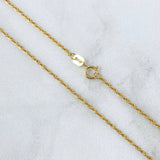 Set Cadena Lazo 1gr / 50cm / 1.2mm + Dije Ancla 0.45gr / 1.7cm Oro Amarillo 18K