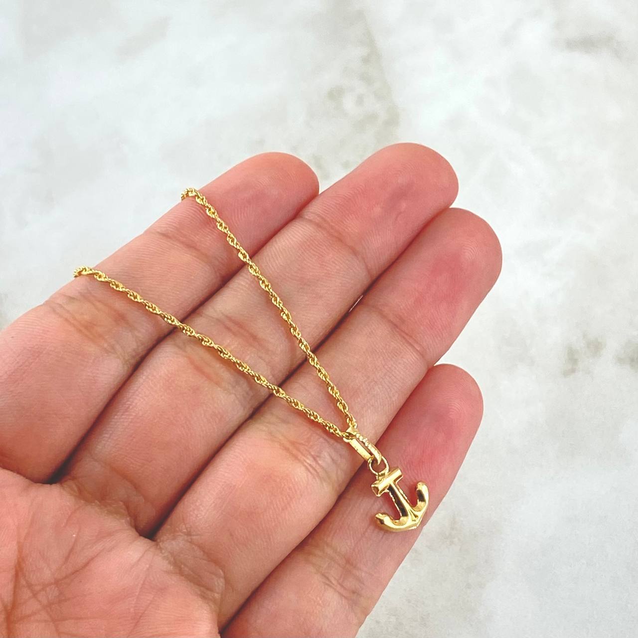 Set Cadena Lazo 1gr / 50cm / 1.2mm + Dije Ancla 0.45gr / 1.7cm Oro Amarillo 18K