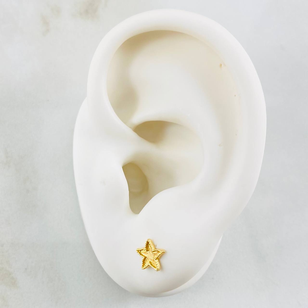 Topos Estrella Bordeada 0.75gr / Oro Amarillo 18K