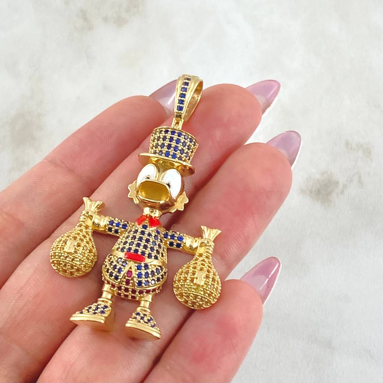 Dije Pato Bolsas Dinero 13.15gr / 5.5cm / Oro Amarillo 18K ©