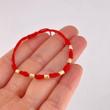 Pulsera Tejida Roja Siete Nudos Oro Amarillo 18K