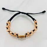 Pulsera Tejida Negra Cruz Cristo Milagroso de Buga Tres Oros 18K