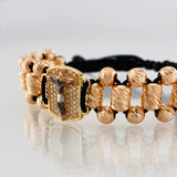 Pulsera Tejida Negra Cruz Cristo Milagroso de Buga Tres Oros 18K