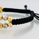 Pulsera Tejida Negra Signo Peso Dos Oros Amarillo Blanco 18K