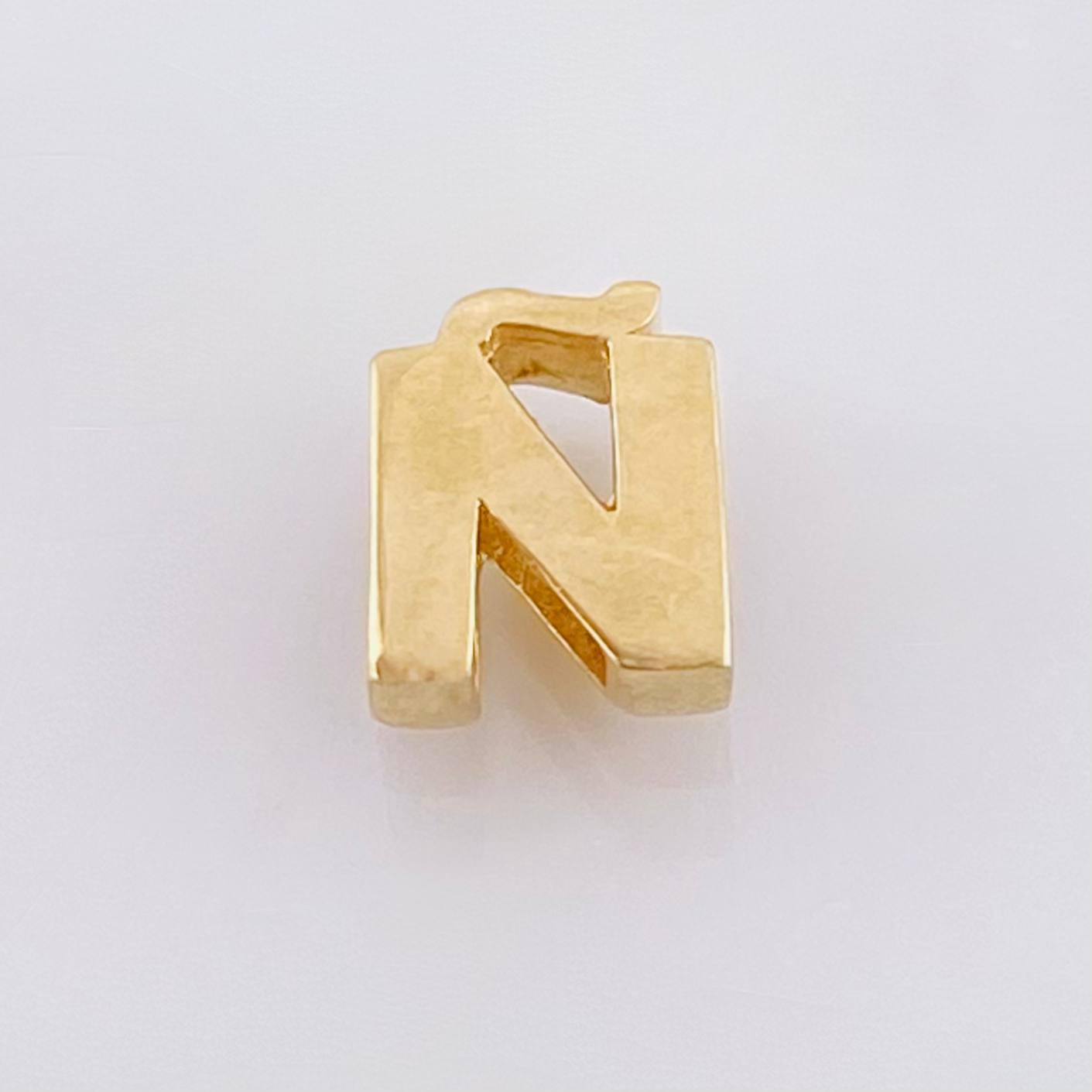 Herraje Tambor Letra Ñ 0.55gr / 7mm Oro Amarillo 18K