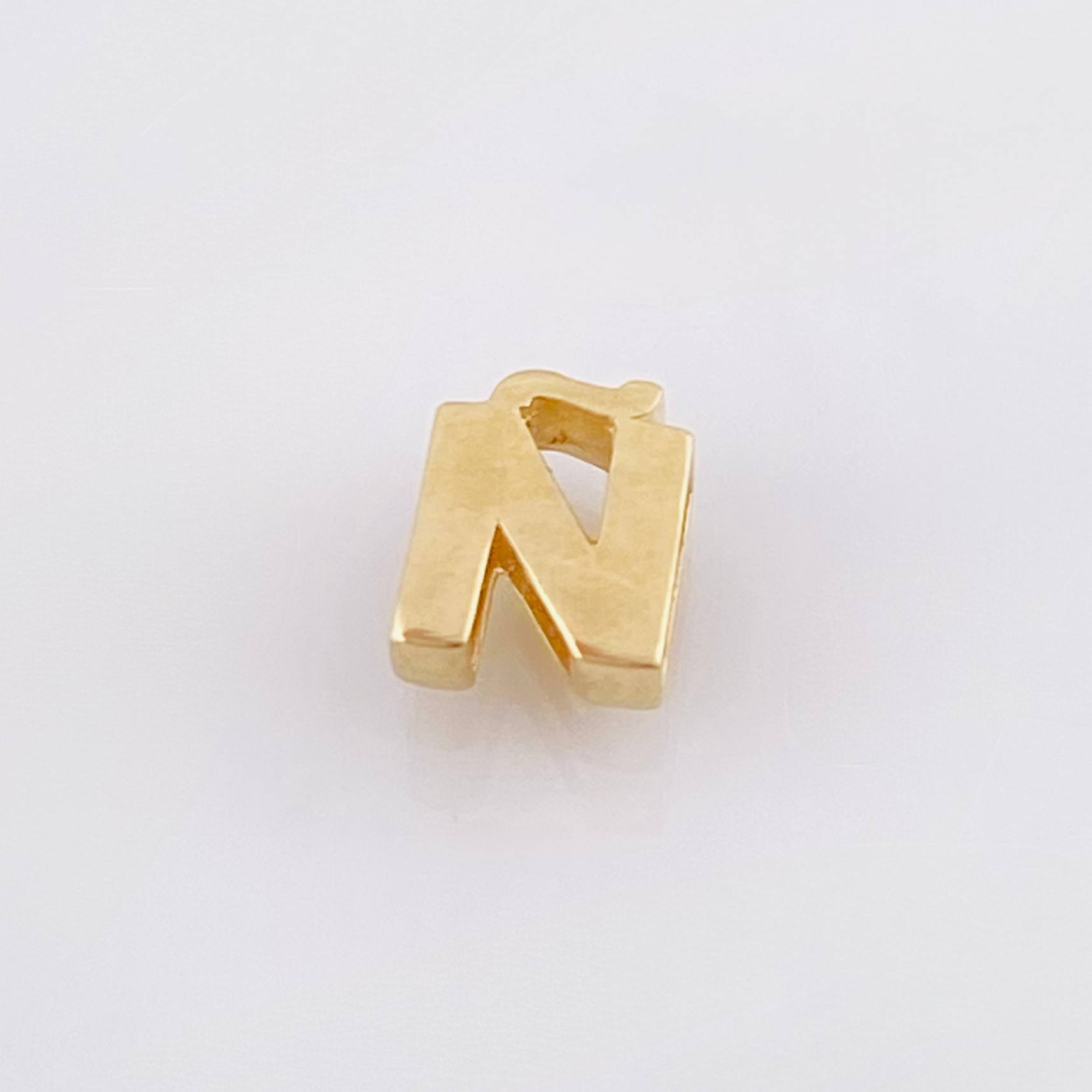Herraje Tambor Letra Ñ 0.5gr / 7mm Oro Amarillo 18K