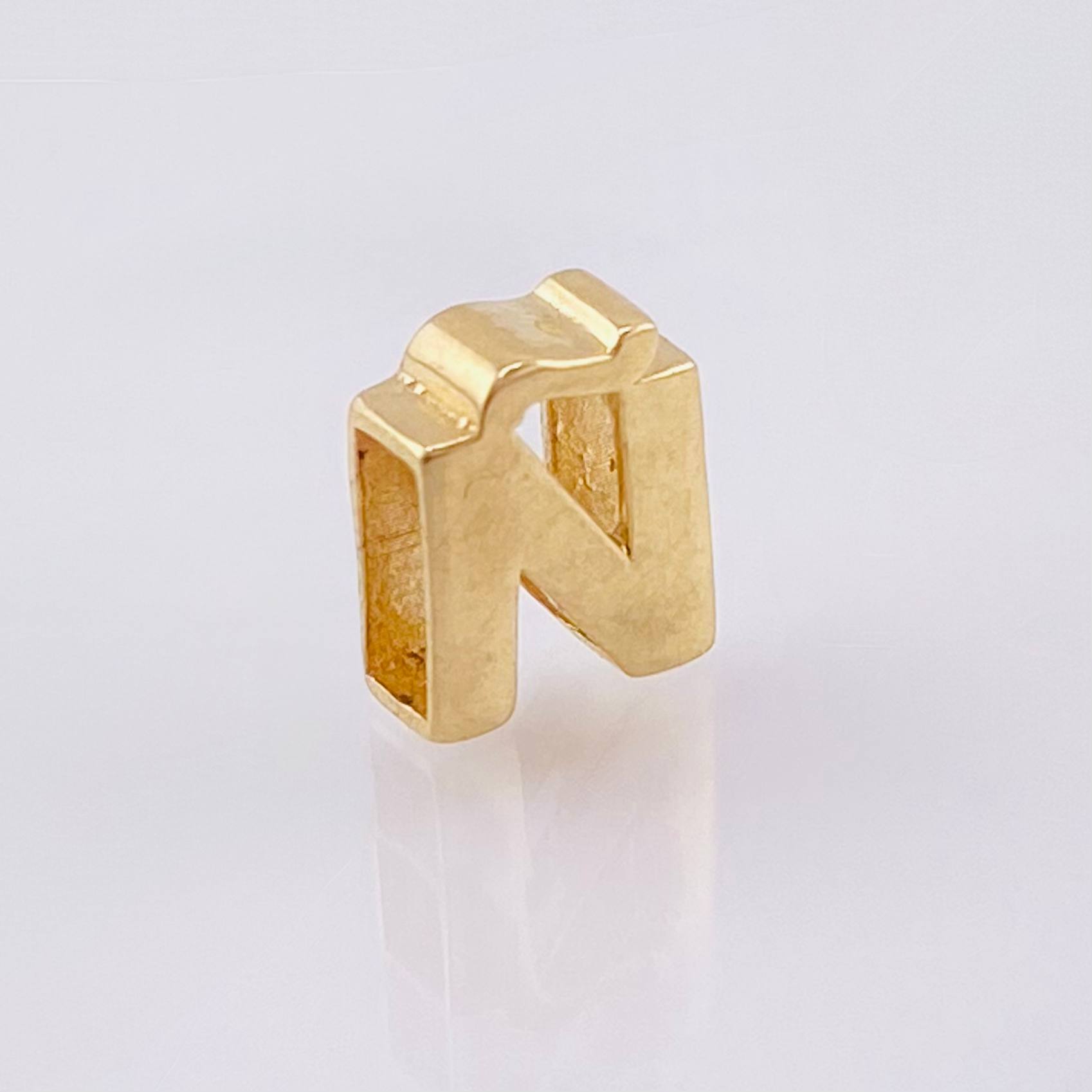 Herraje Tambor Letra Ñ 0.55gr / 7mm Oro Amarillo 18K