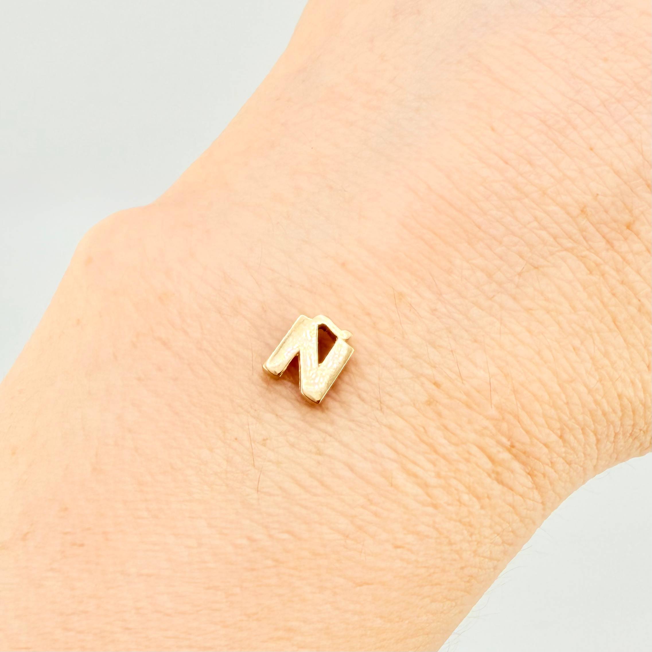 Herraje Tambor Letra Ñ 0.5gr / 7mm Oro Amarillo 18K