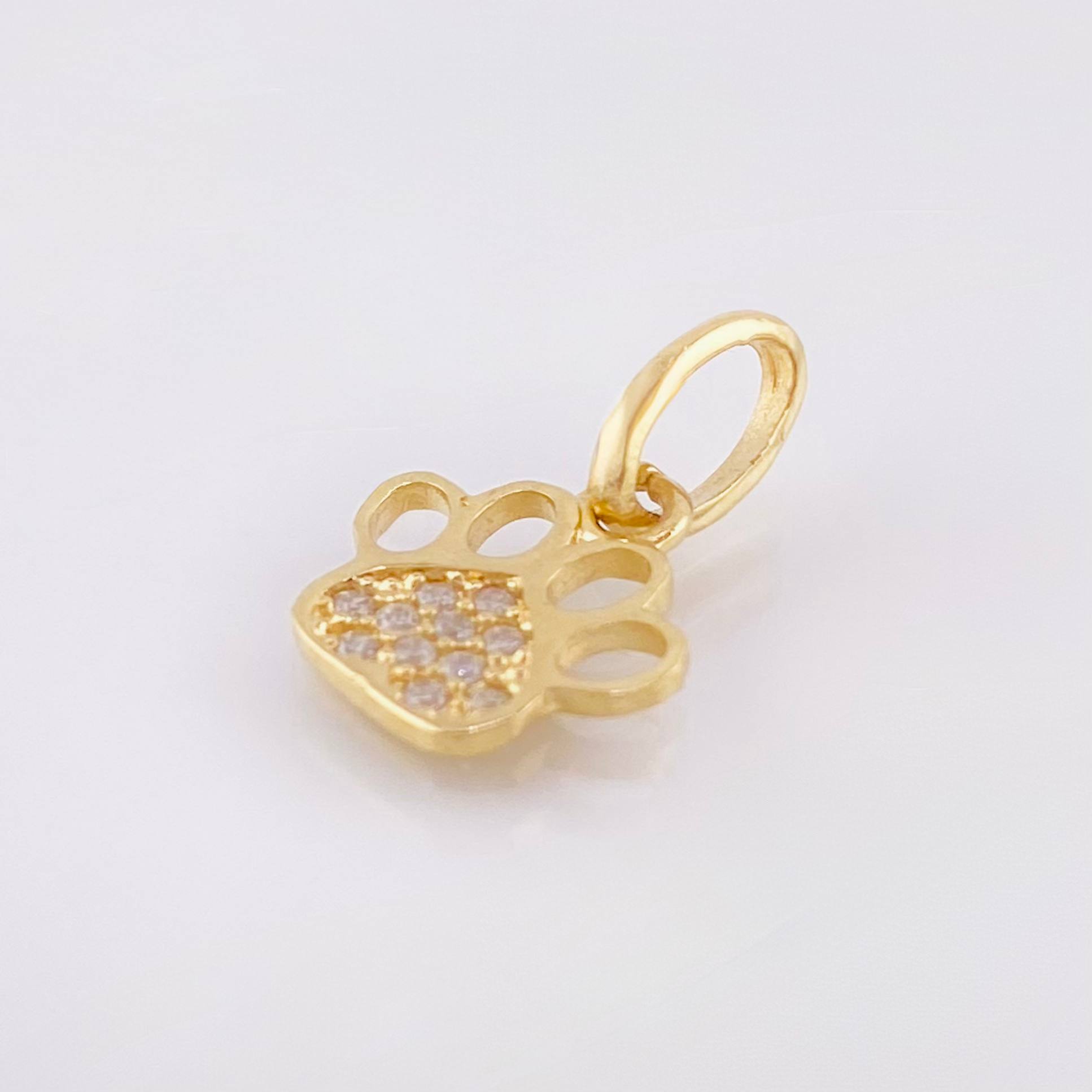 Dije Huella 0.65gr / 1.5cm / Oro Amarillo 18K