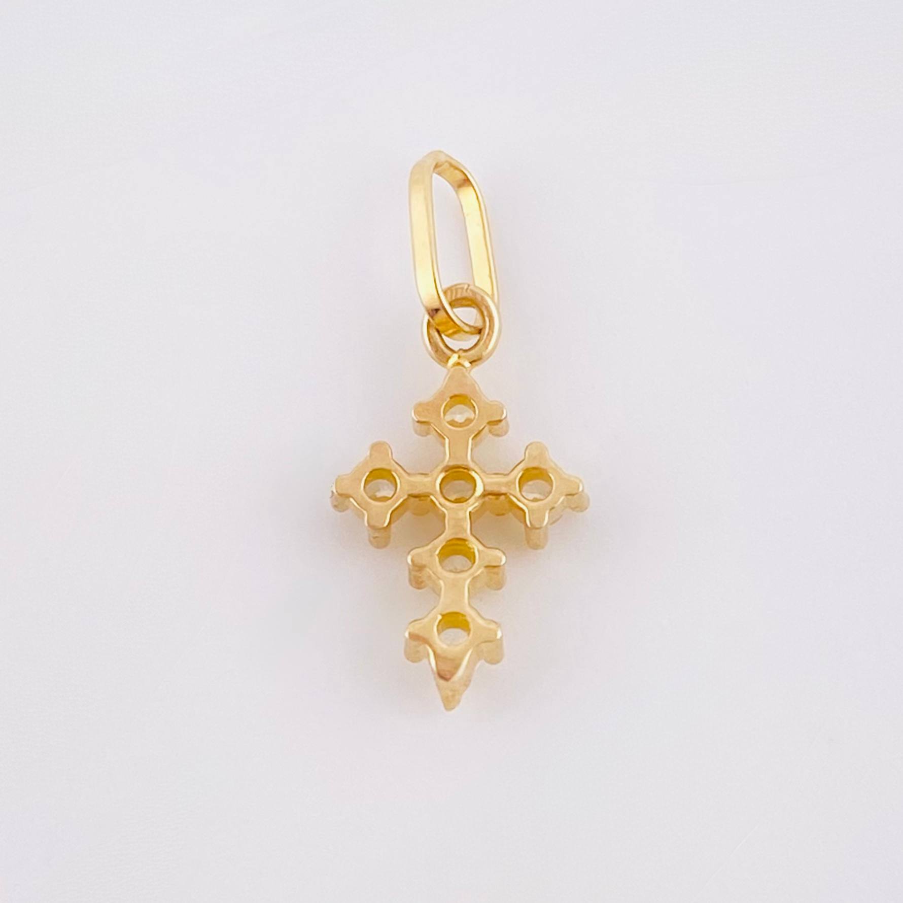 Dije Cruz Tupida 0.45gr / 1.05cm / Oro Amarillo 18K ©