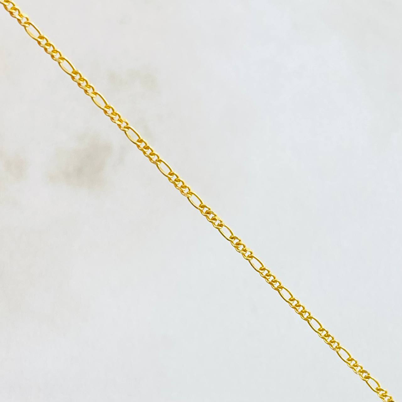 Cadena Figaro 2.3gr / 60cm / 1.1mm Oro Amarillo +1 18K *