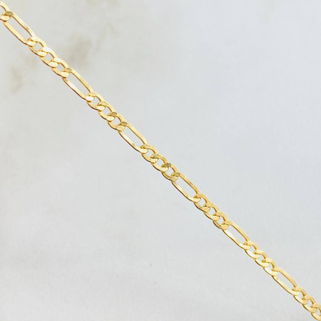 Pulso Figaro 1.25gr / 19.5cm / 2.5mm Oro Amarillo +1 18K