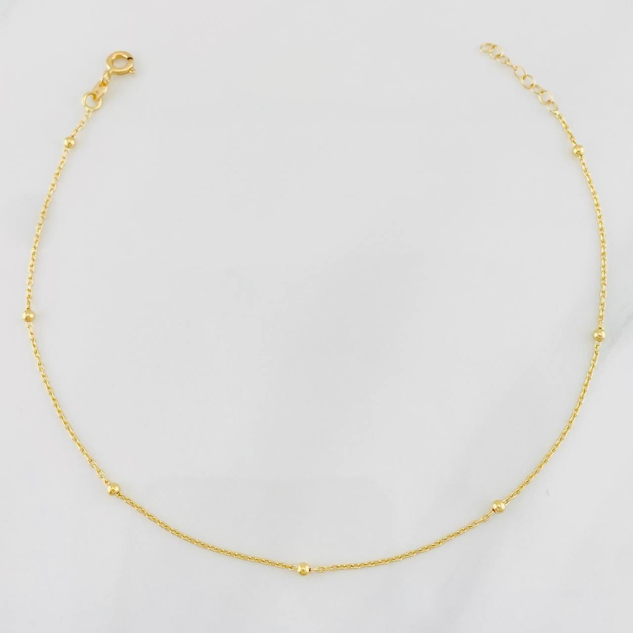 Tobillera Aro Seguido Bolas 1.3g / 22.5cm-24cm / 1mm Oro Amarillo 18K