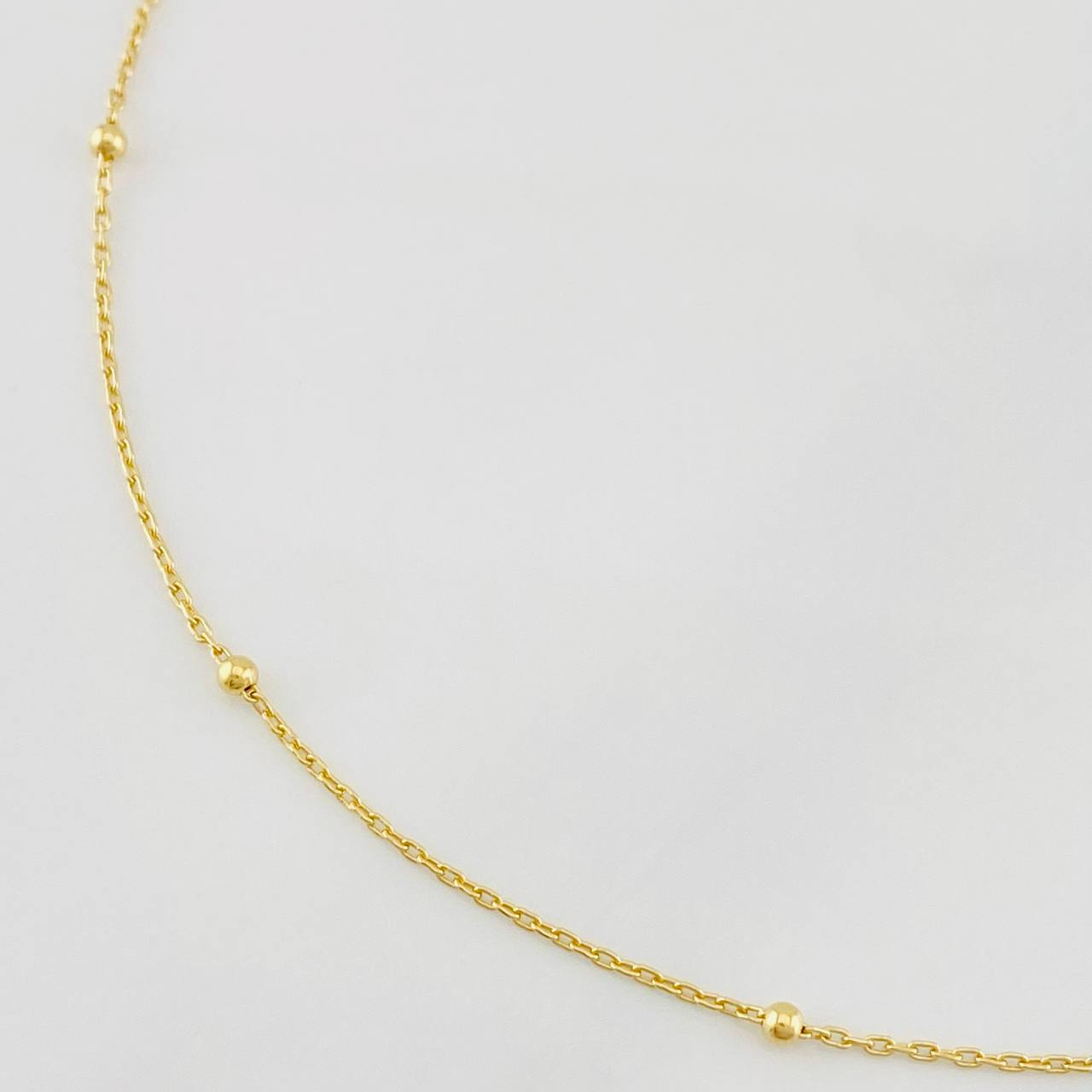 Tobillera Aro Seguido Bolas 1.3g / 22.5cm-24cm / 1mm Oro Amarillo 18K