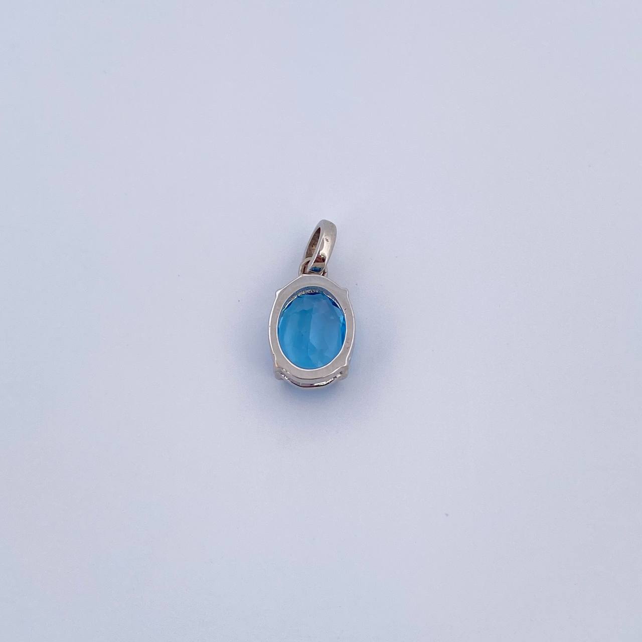 Dije Ovalo 0.95gr / 1.4cm / Circon Azul Oro Blanco 18K &