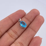 Dije Ovalo 0.95gr / 1.4cm / Circon Azul Oro Blanco 18K &