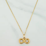 Set Cadena Escalera Plana + Dije Infinito / 2.15gr / 50 cm Tres Oros 18K