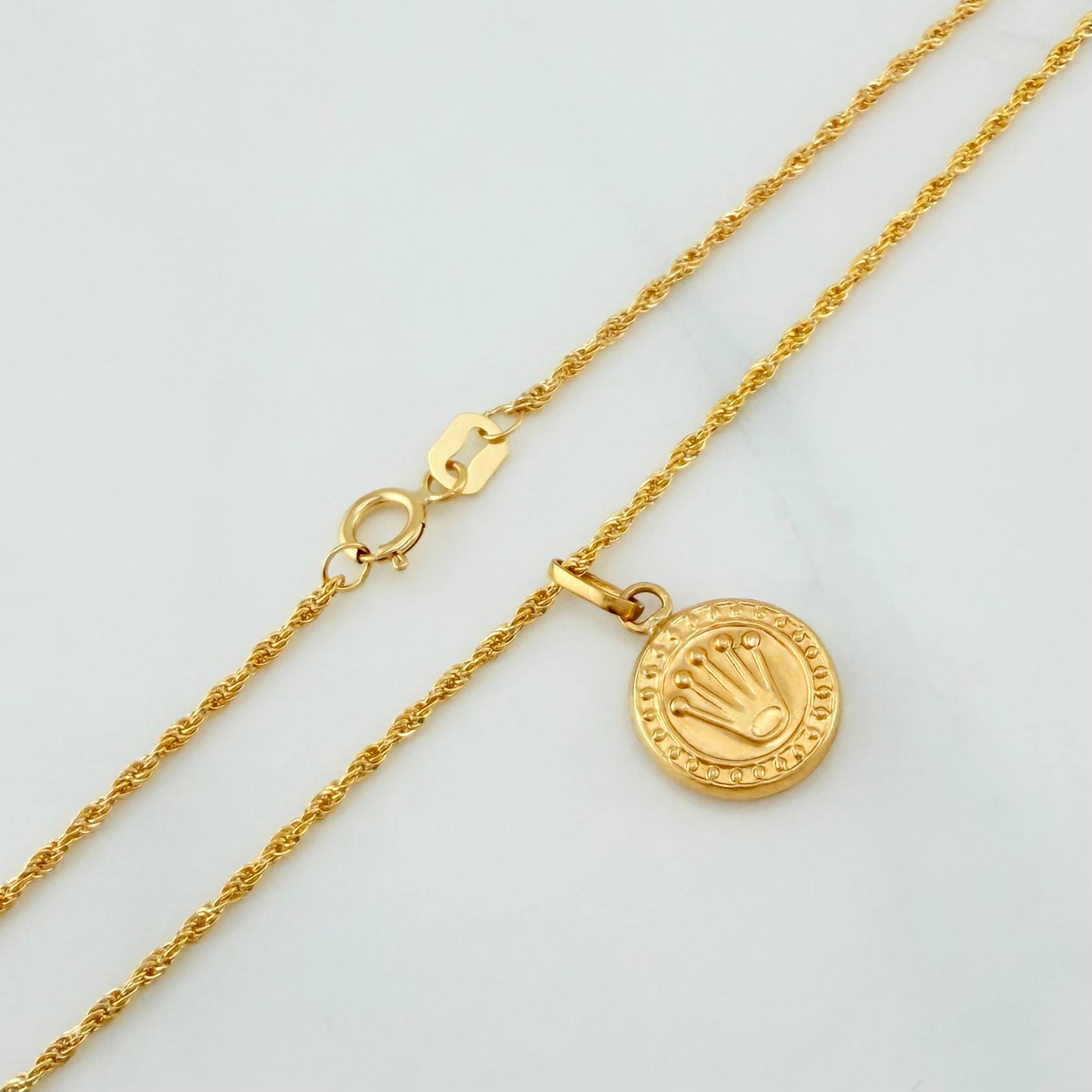 Set Cadena Lazo + Dije Corona / 1.75gr / 60 cm Oro Amarillo 18K