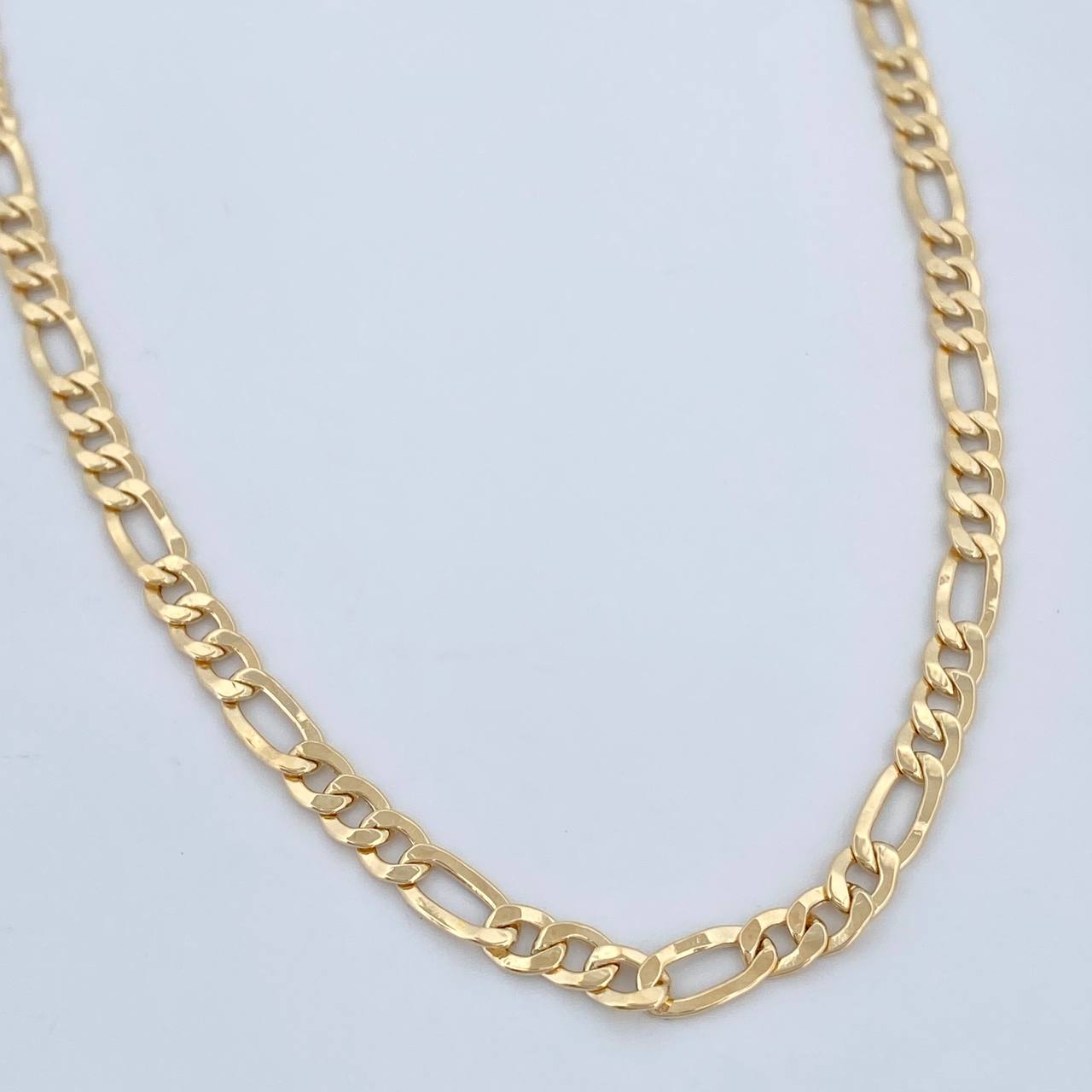 Cadena Figaro 9.5gr / 60.5cm / +1 Oro 18K &