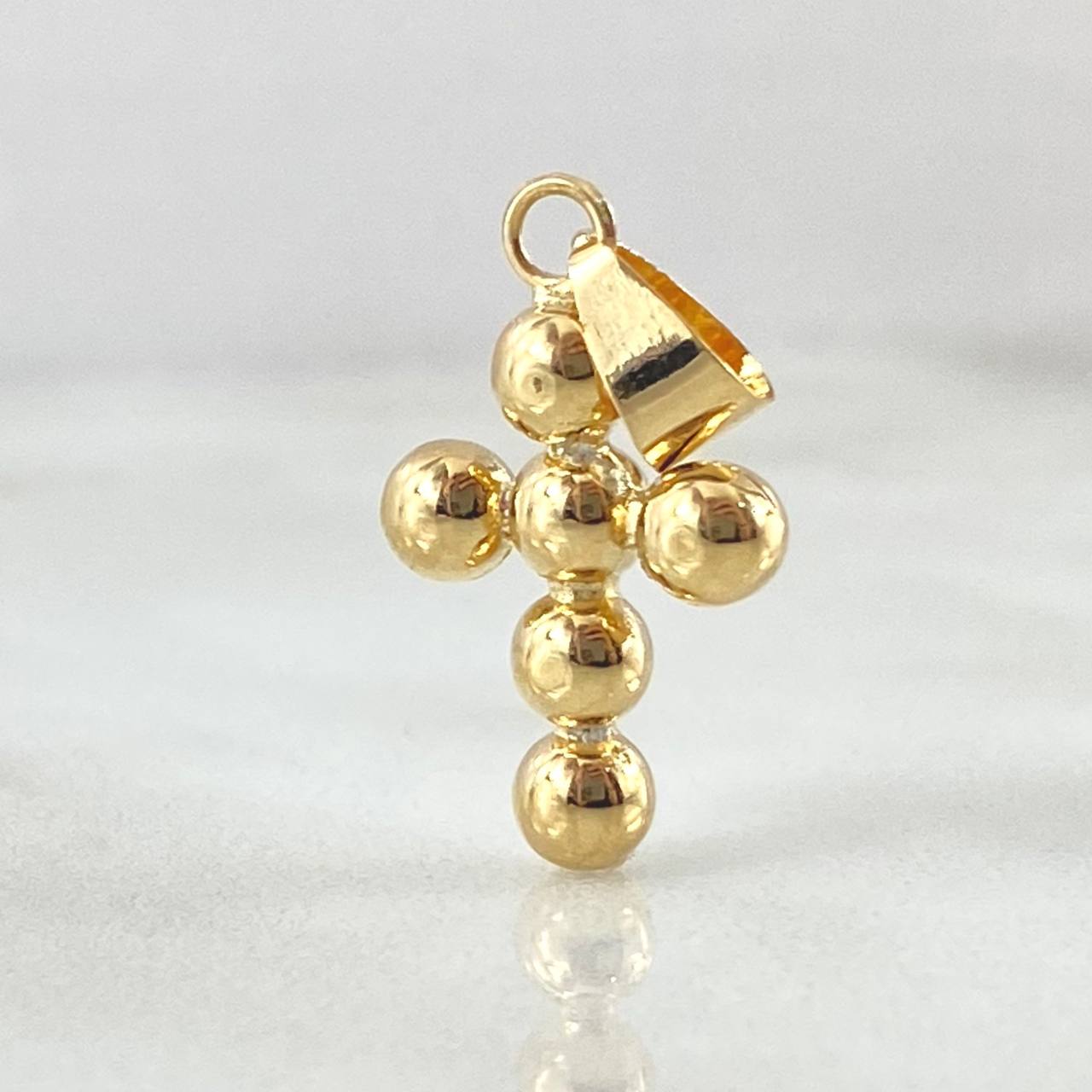 Dije Cruz Esferas Consecutivas 0.85gr / 2.4cm / Oro 18K