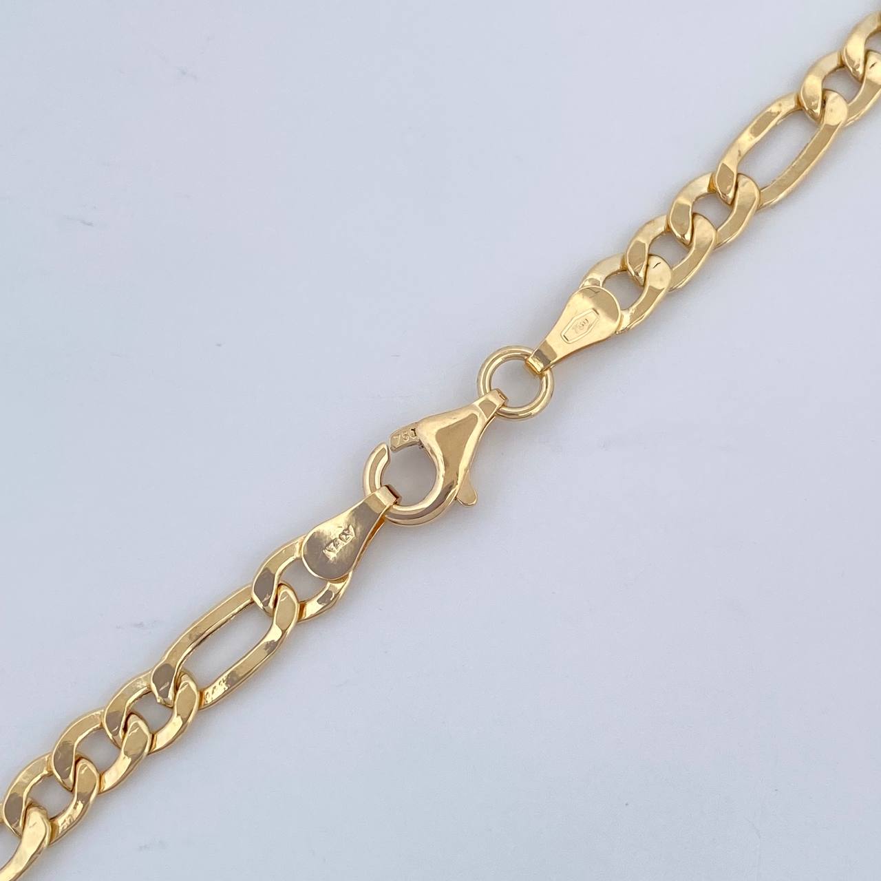 Cadena Figaro 9.5gr / 60.5cm / +1 Oro 18K &