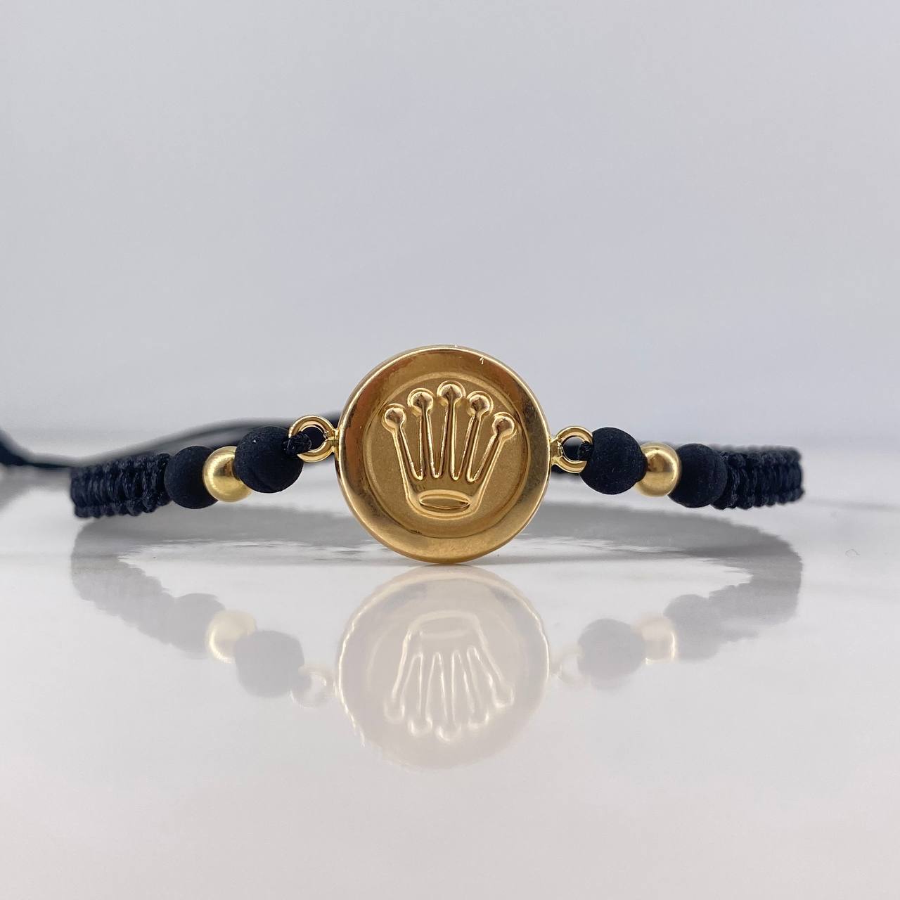 Pulsera Negra Herraje Corona RX 1.4gr / 4mm Bolas Lisas Troquelada Oro Amarillo 18K &