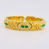 Pulso Aro Corazones Entrelazados Diamantes 2.17qts Esmeraldas 96pts 59.65g / 15cm / 11.8mm Oro Amarillo 18K