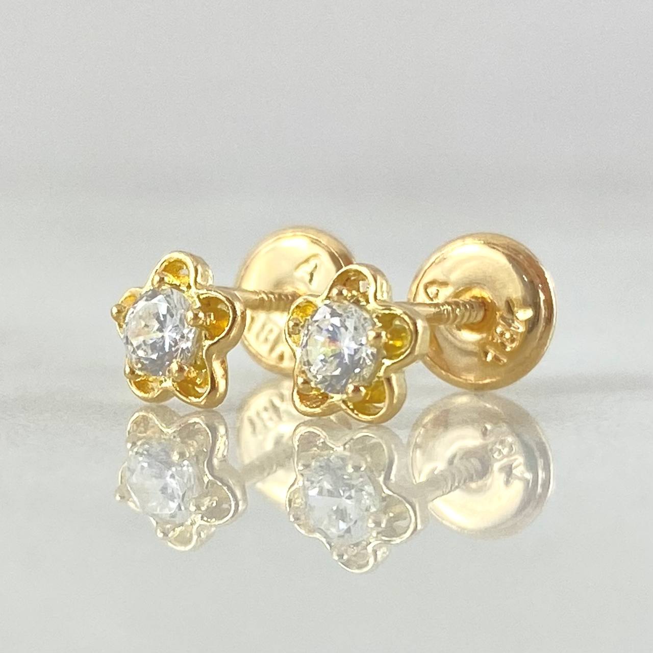 Topos Flor 0.9gr / Oro Amarillo 18K ©