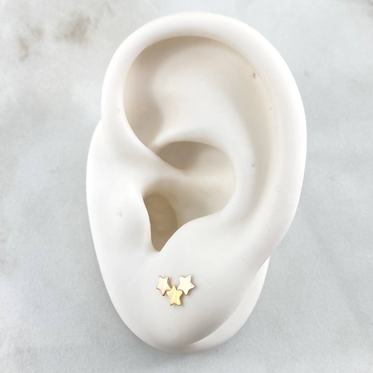 Topos Trio Estrellas 0.55gr / Tres Oros 18K ©