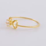 Anillo Moño Chispa 1.1 g / T7 Oro Amarillo 18K
