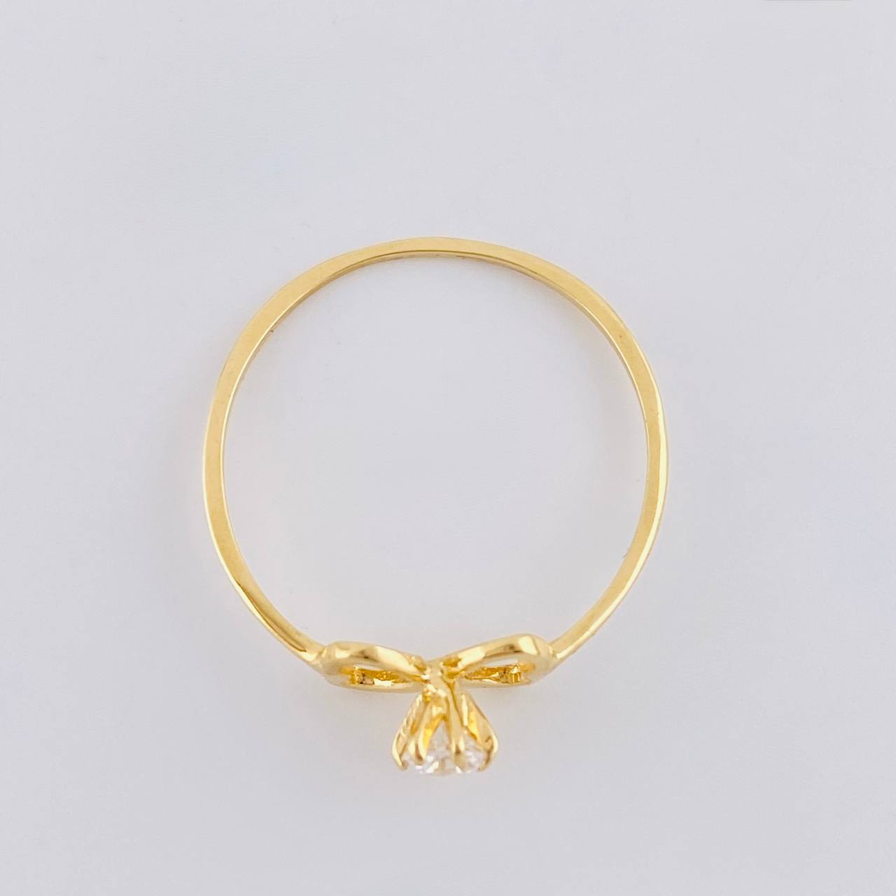 Anillo Moño Chispa 1.1 g / T7 Oro Amarillo 18K