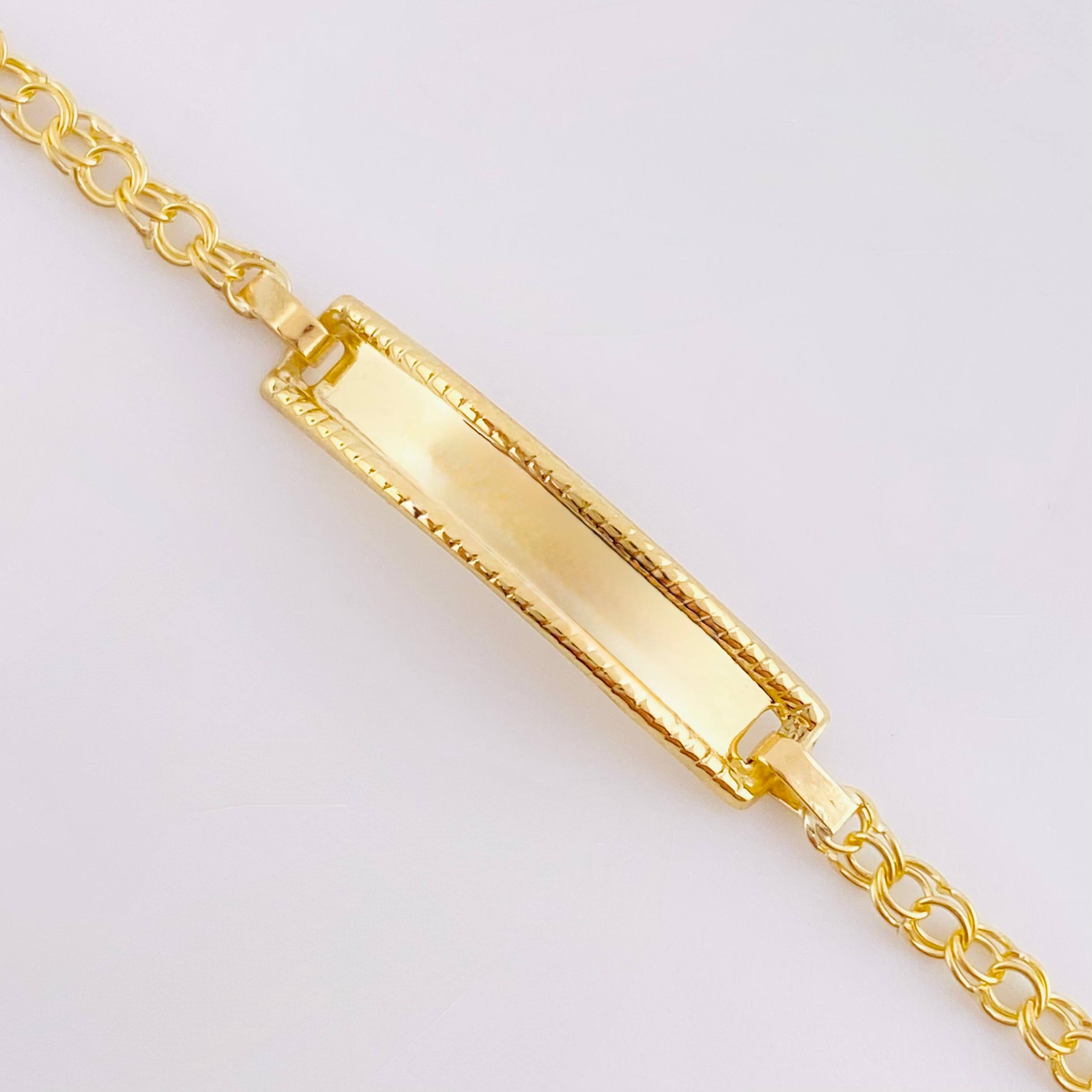 Pulso Bebé Roll ON Placa Rectangular Relieve 1.35gr / 14.5cm / 2.3mm Oro Amarillo 18K