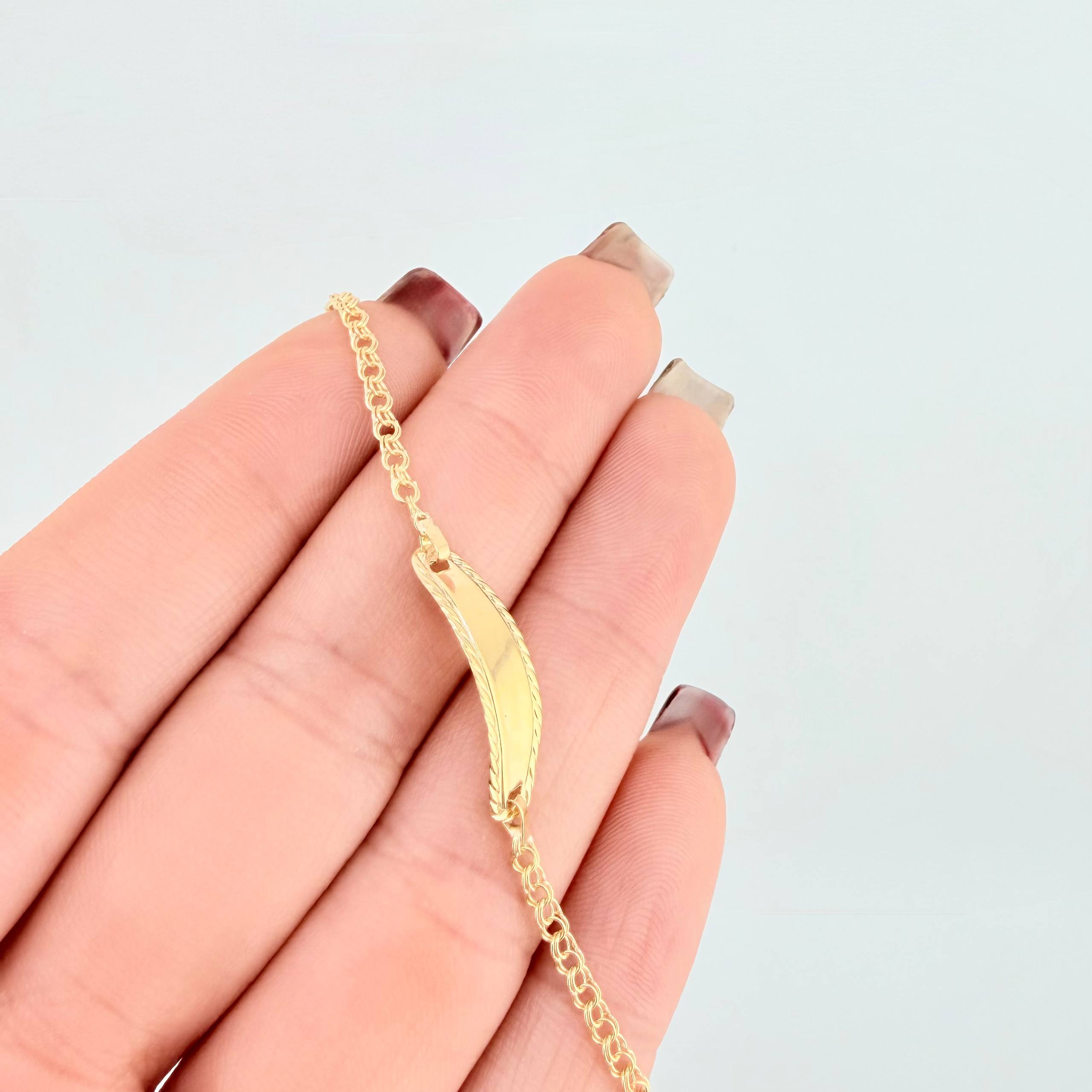Pulso Bebé Roll On Placa Ovalada Relieve 1.35gr / 14.5cm / 2.3mm Oro Amarillo 18K