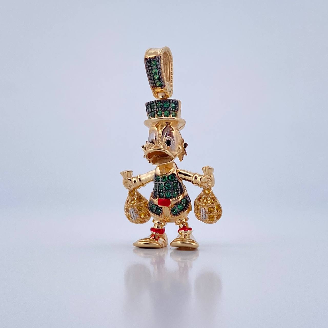 Dije Pato Bolsas Dinero 6.15gr / 3.3cm / Circones Verdes Amarillos Negros Tres Oros 18K $