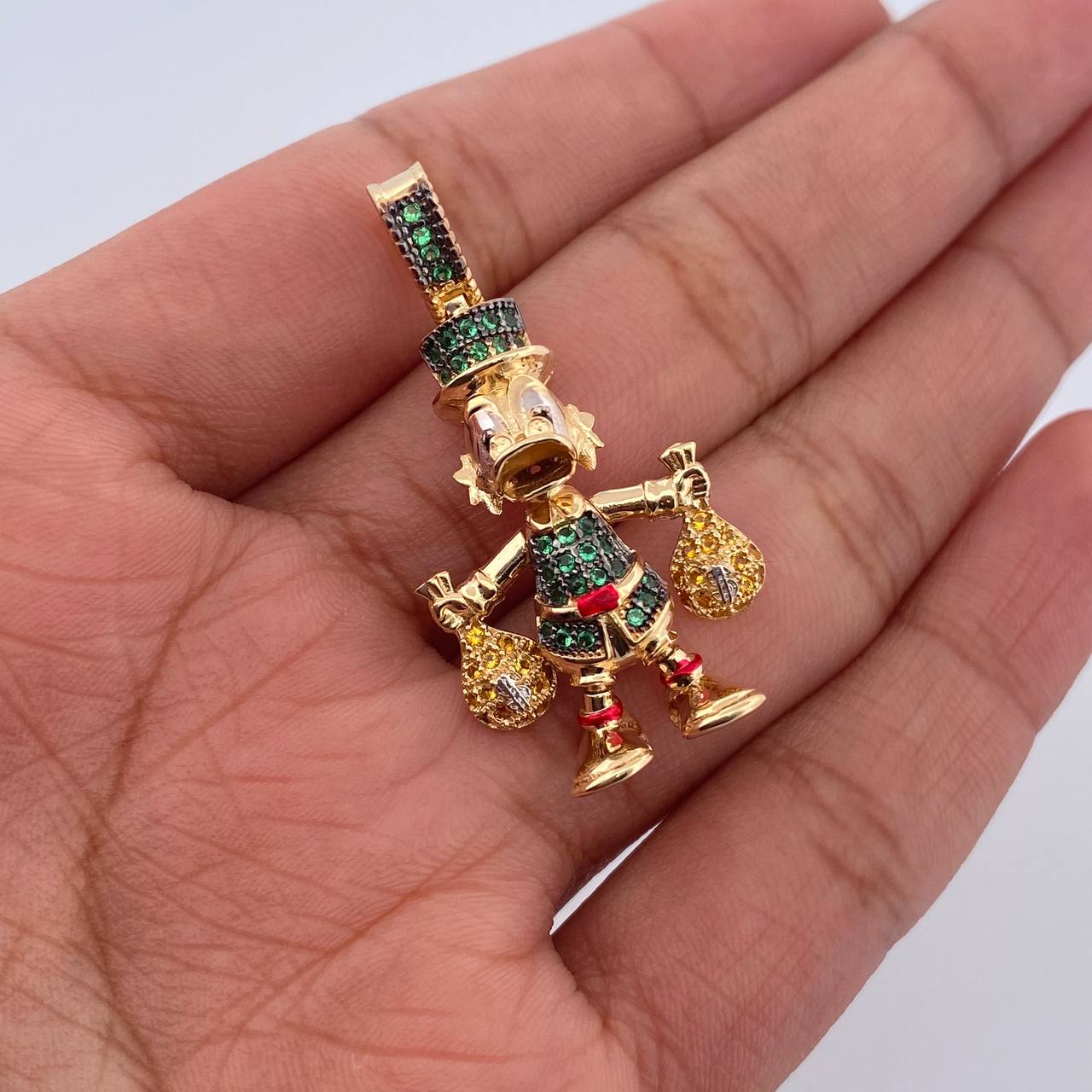 Dije Pato Bolsas Dinero 6.15gr / 3.3cm / Circones Verdes Amarillos Negros Tres Oros 18K $