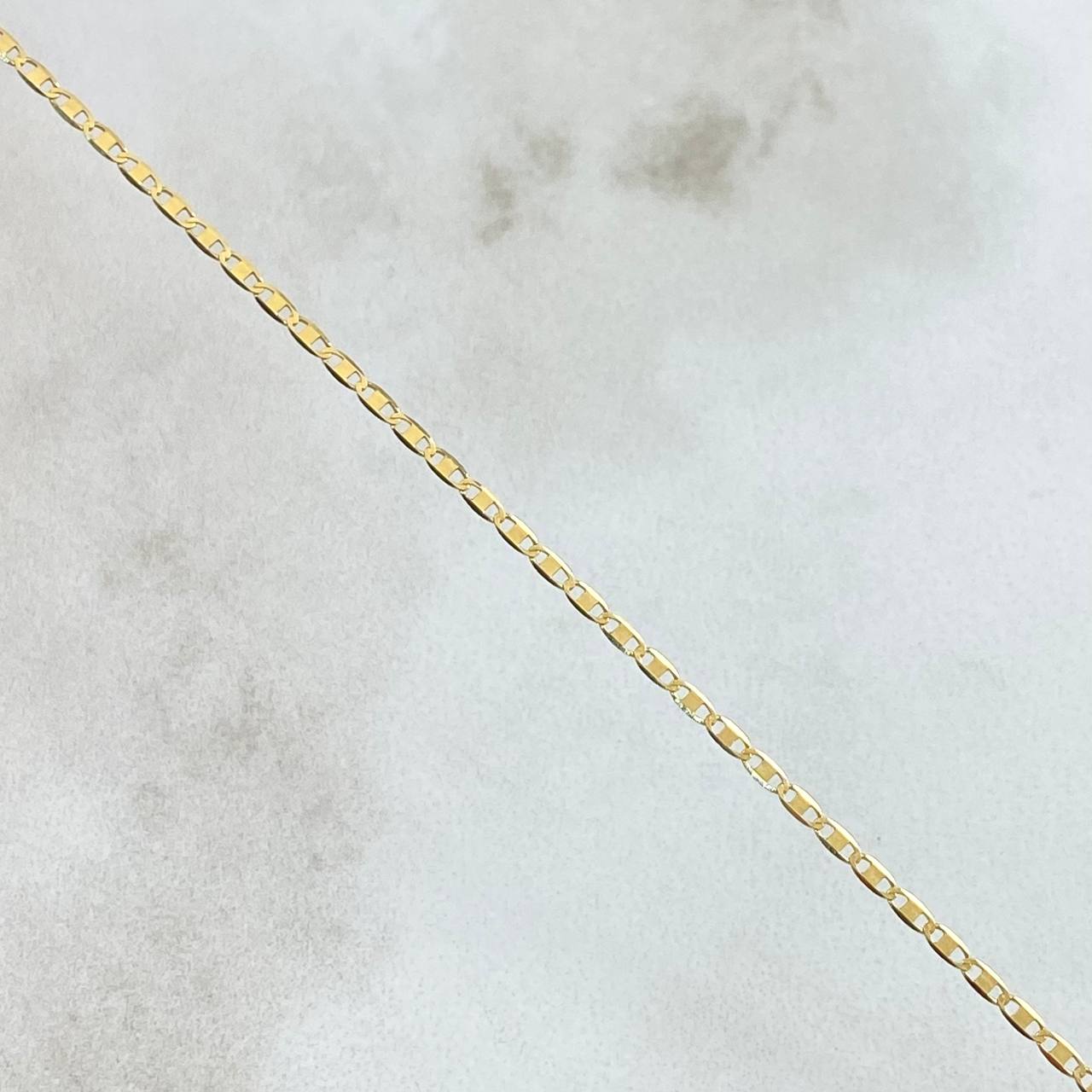 Cadena Plana 1.55gr / 50cm / 1.3mm Oro Amarillo +3 18K