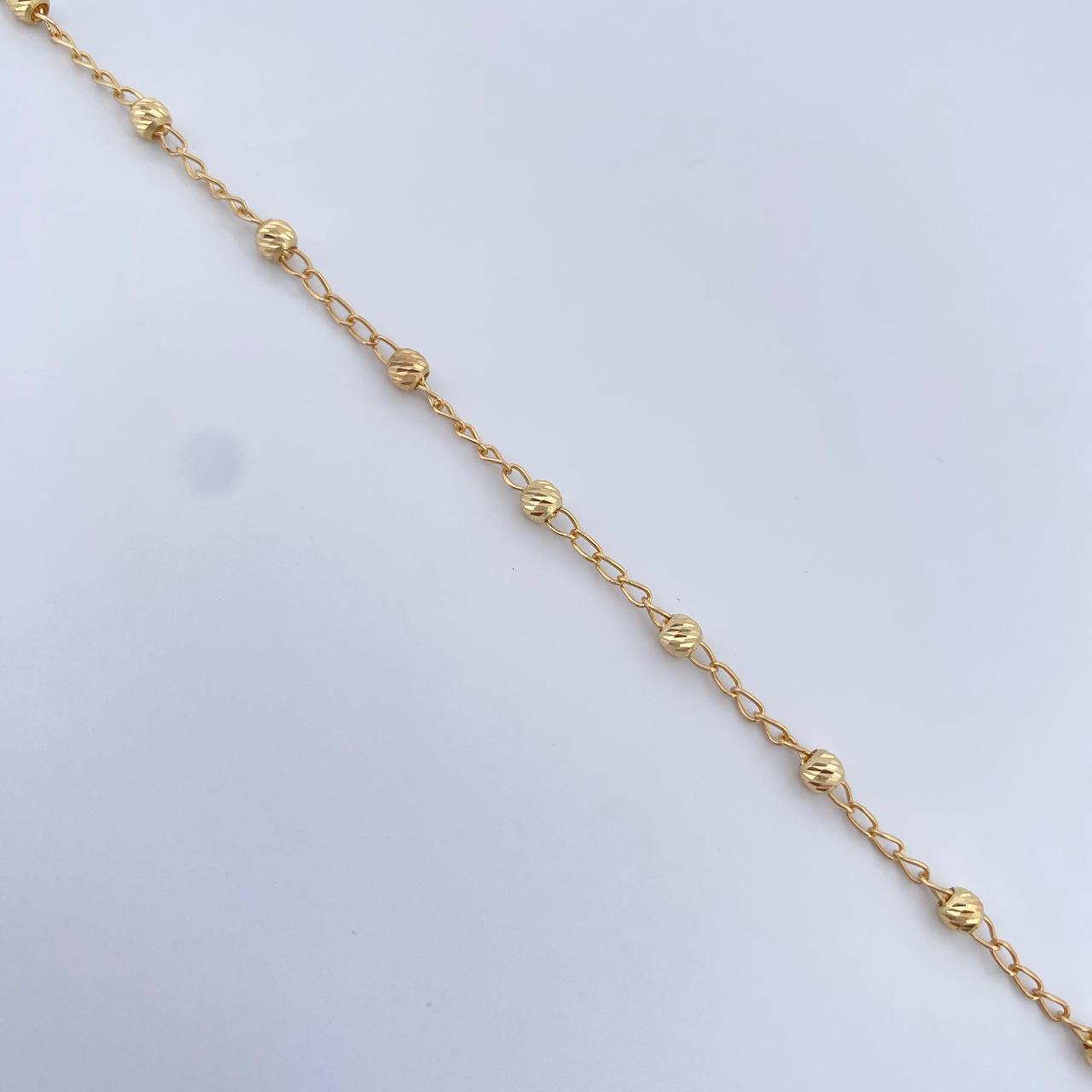 Pulso Tipo Militar Espiga 1.85gr / 19.6cm / 3mm Bolas Diamantadas Oro Amarillo 18K $
