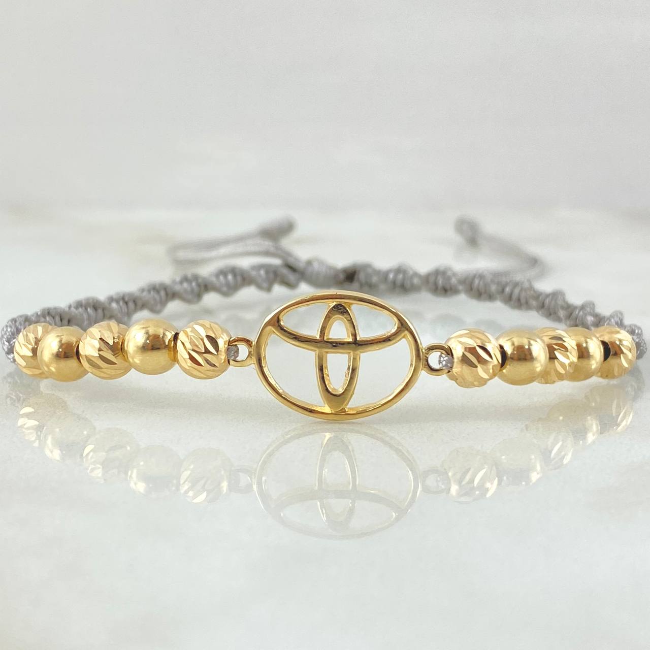 Pulsera Gris Herraje Marca Automovil 2.55gr / Oro Amarillo 18K *