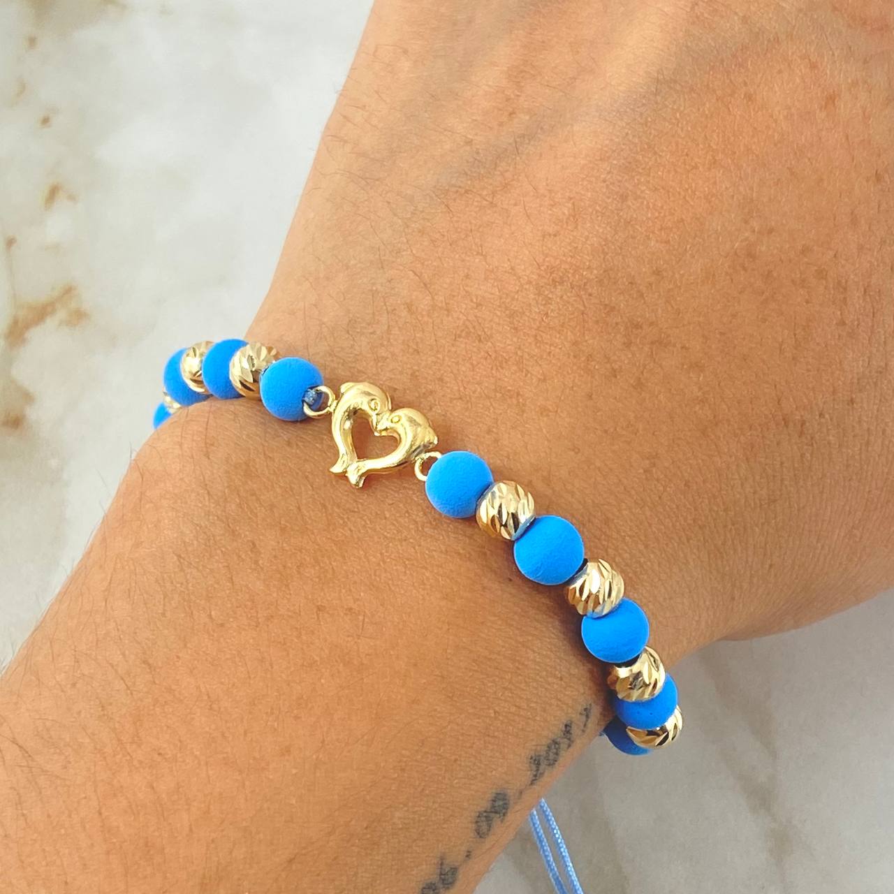Pulsera Azul Celeste Herraje Delfines 1.65gr / Oro Amarillo 18K *