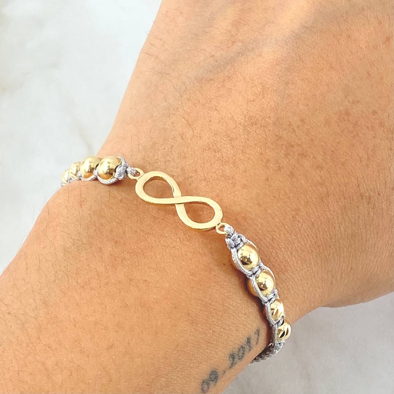 Pulsera Gris Herraje Infinito 2.1gr / Oro Amarillo 18K ©