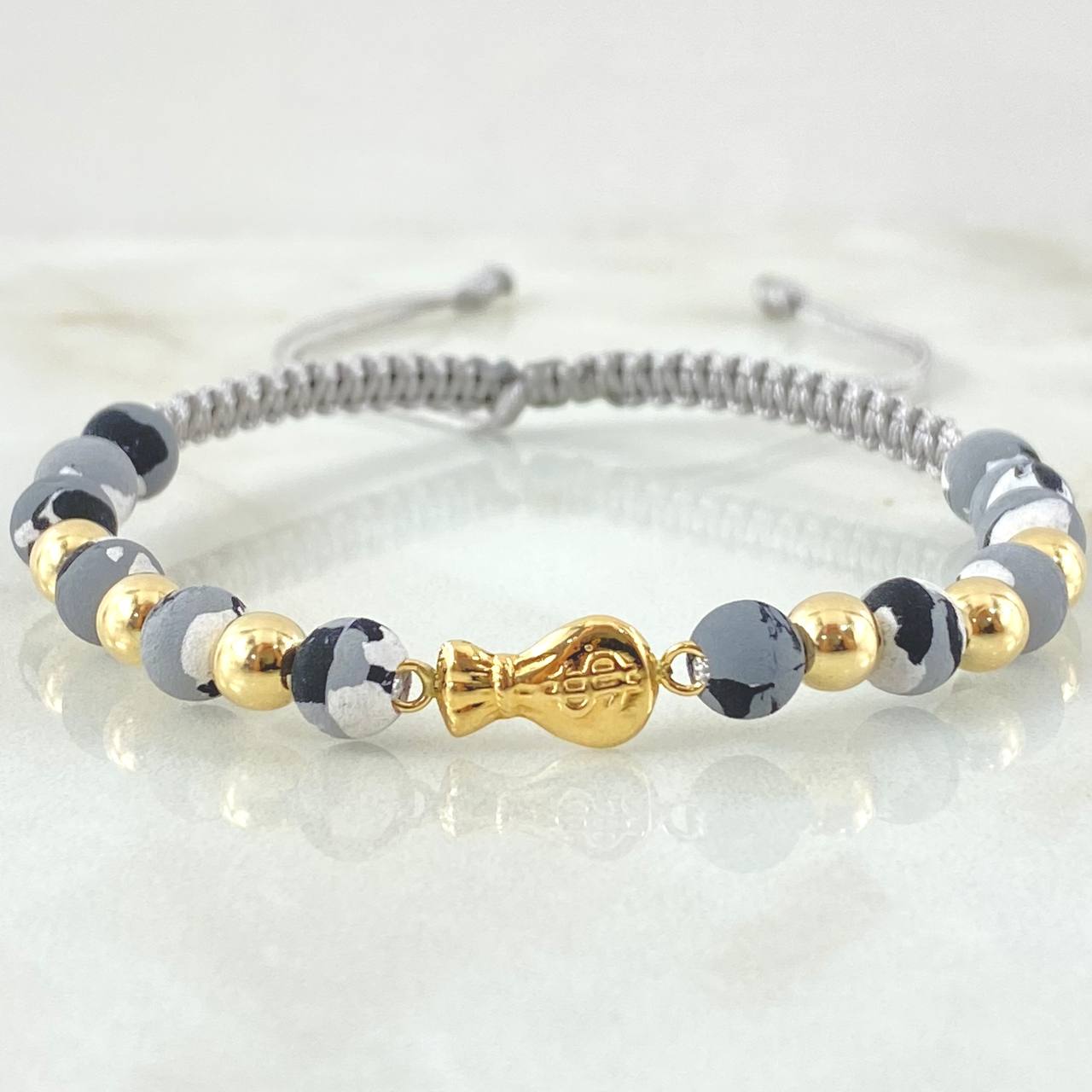 Pulsera Gris Herraje Bolsa Dinero 1.25gr / Oro Amarillo 18K ©