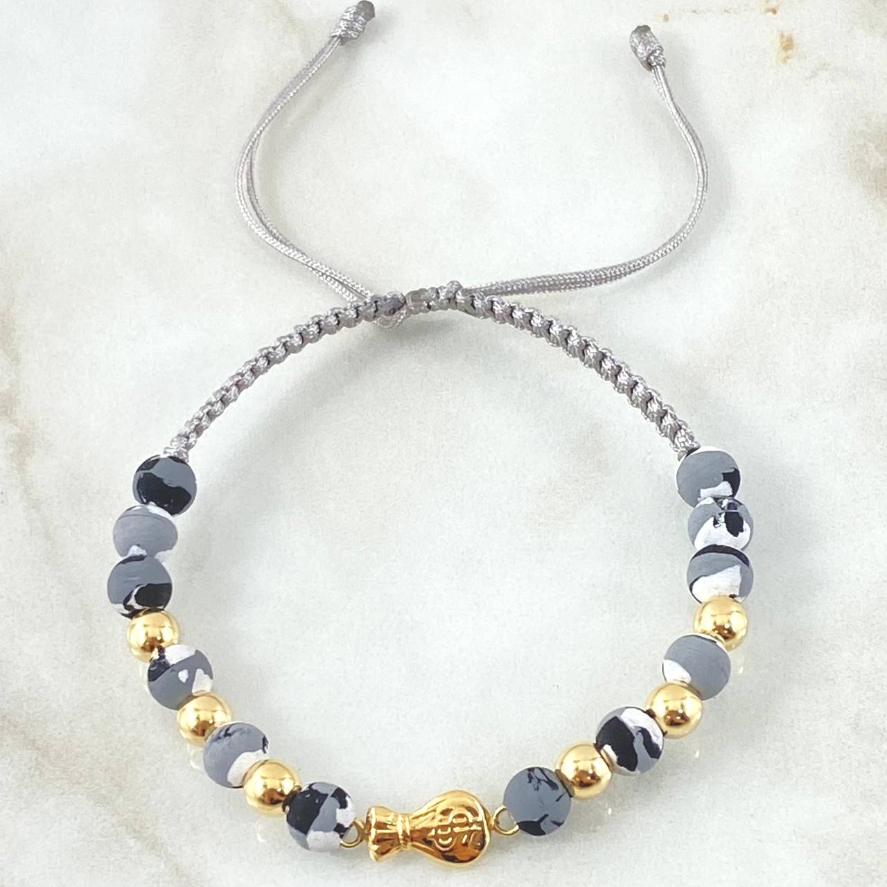 Pulsera Gris Herraje Bolsa Dinero 1.25gr / Oro Amarillo 18K ©