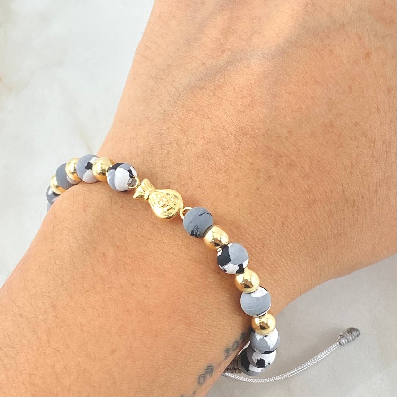 Pulsera Gris Herraje Bolsa Dinero 1.25gr / Oro Amarillo 18K ©