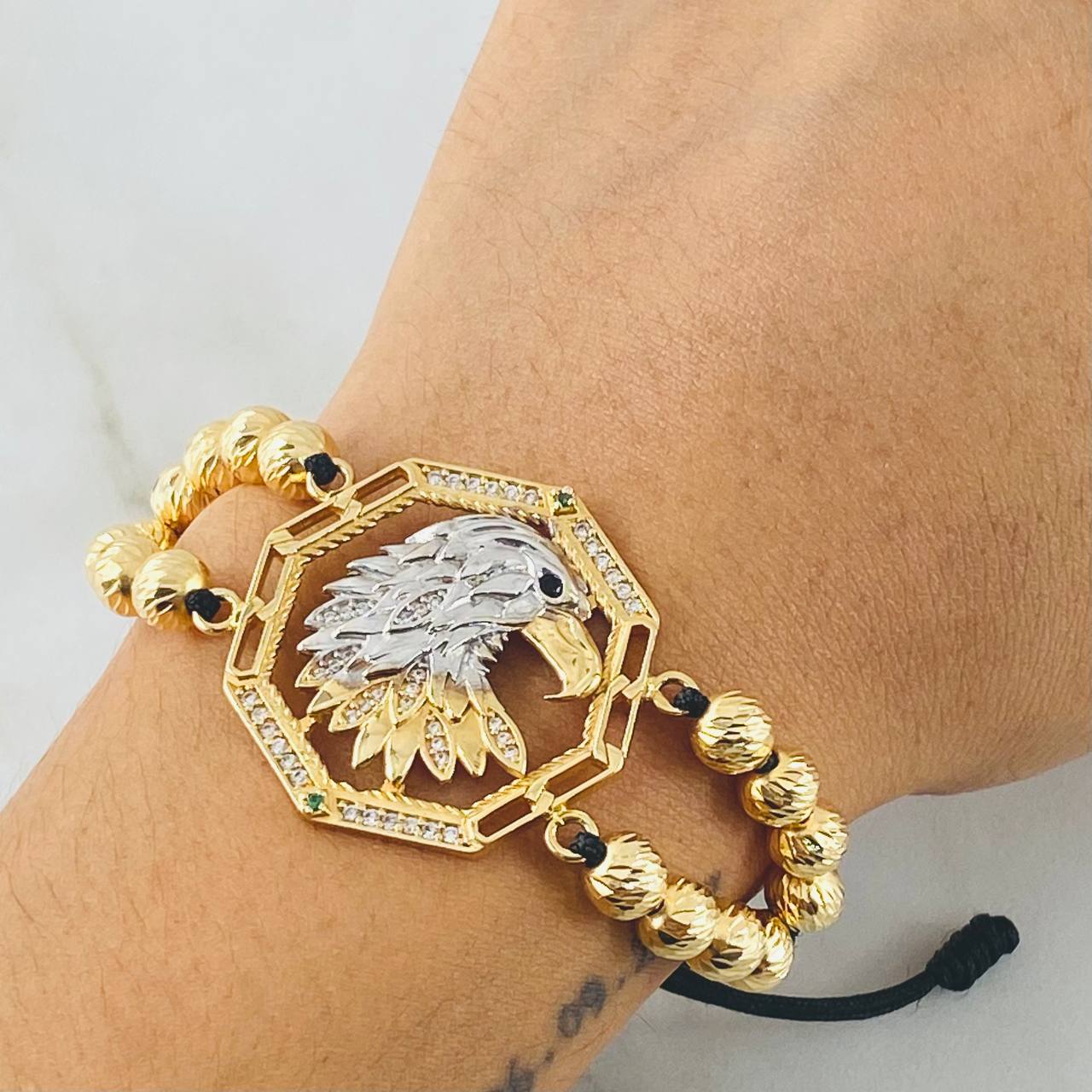 Pulsera Negra Herraje Aguila 13.1gr / Dos Oros Amarillo Blanco 18K ©